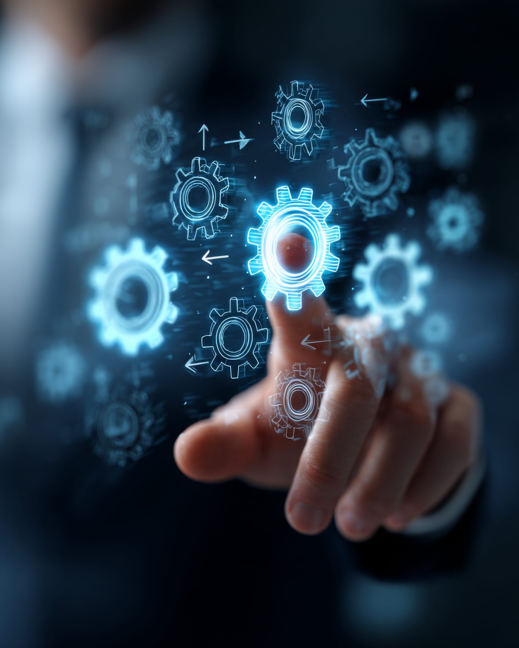 A manager’s finger activates workflow automation on a digital interface, symbolizing efficiency and streamlined operations.